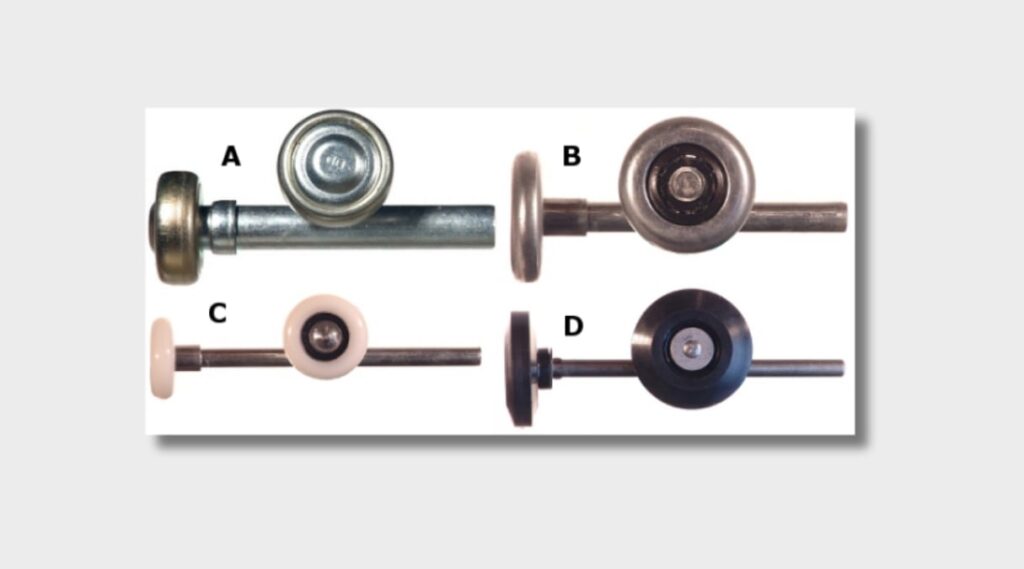 A close-up shot showing the different types of garage door rollers (steel, nylon, ball bearing) placed side by side. This will visually represent the choices available and how each type differs in material and design.